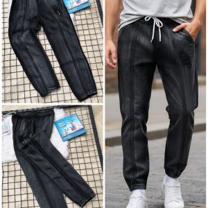 Front view of men’s dark washed-out black jogger pants on a model