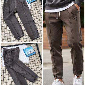 Front view of men’s light brown jogger pants on a model