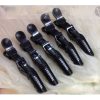 “Toni & Guy black crocodile hair clips set on white background.”