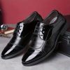 Close-up view of black patent leather derby shoe showing glossy finish.