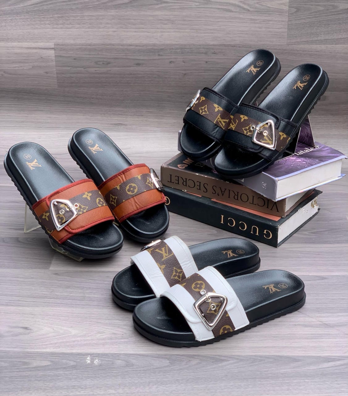 Louis Vuitton-inspired women's slide slippers with monogram strap and buckle in brown, black, and white