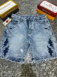 Lifestyle image of denim shorts styled with casual tee and sneakers