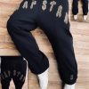 Front view of men’s fashion black joggers on a model