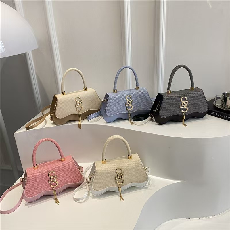Collection of sequined wave-bottom crossbody handbags in multiple colors