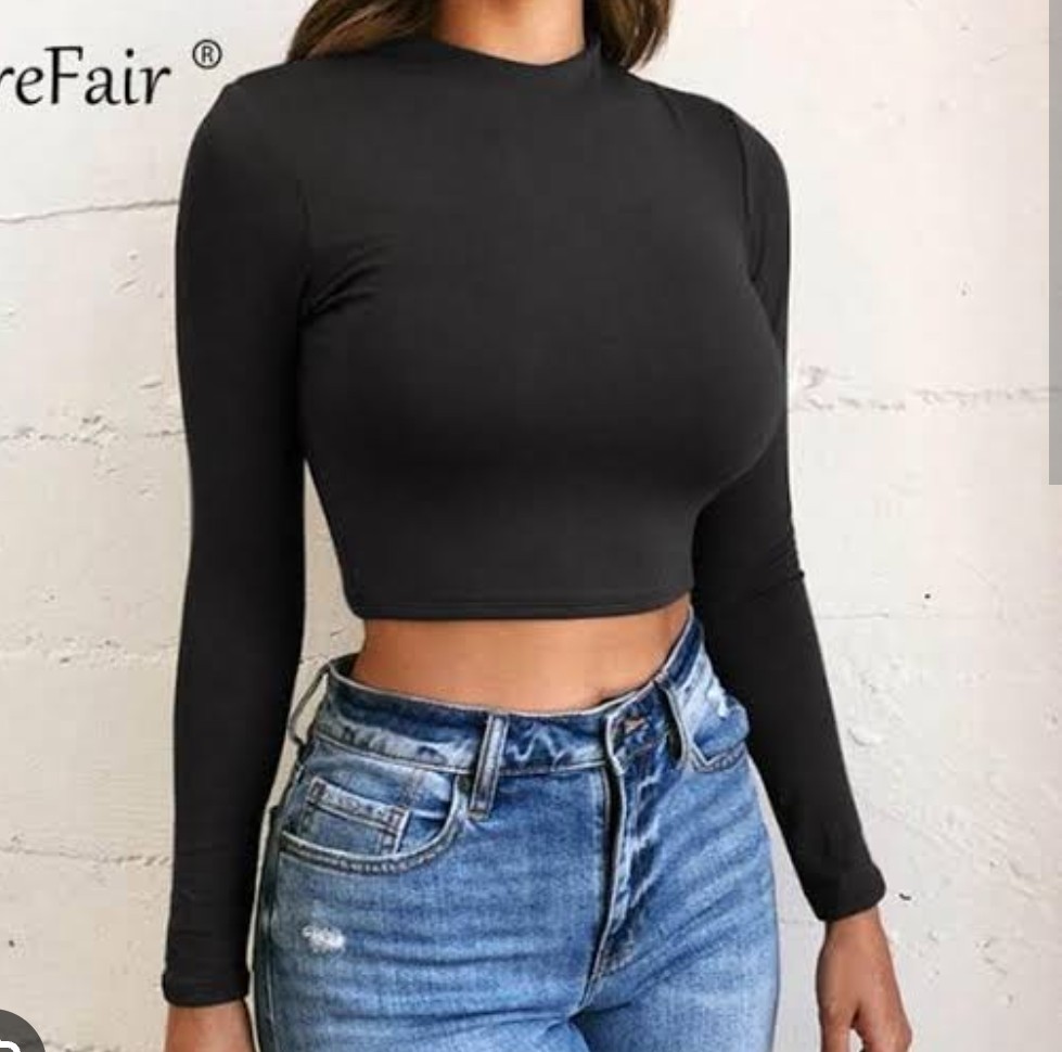 Black long sleeve crop top for women styled for casual and streetwear fashion.