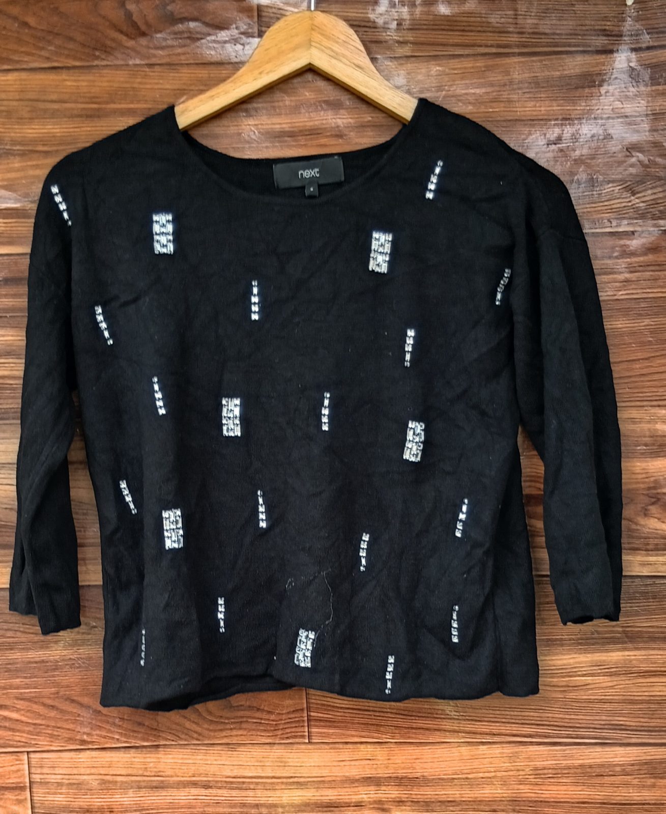 Next black top with white design